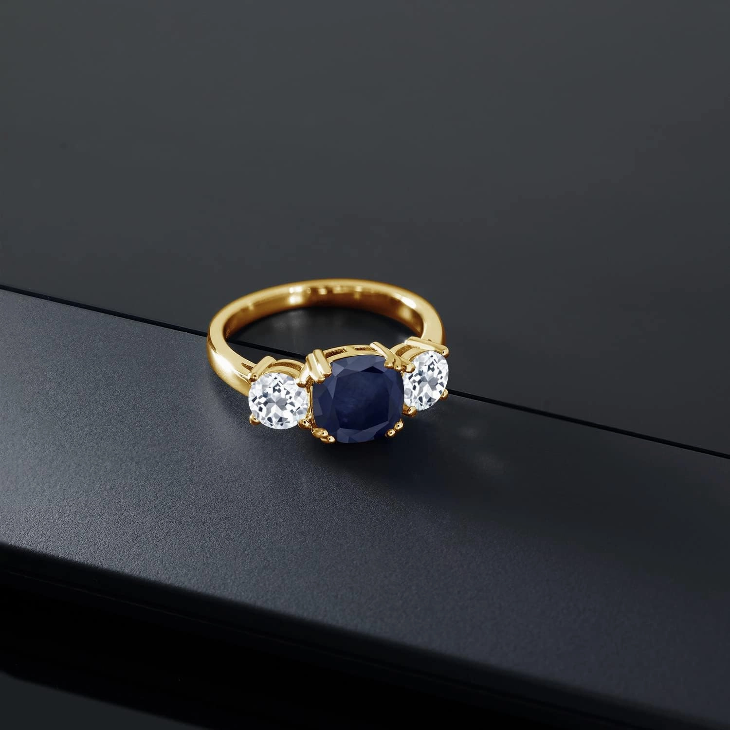 Gem Stone King 18K Yellow Gold Plated Silver Blue Sapphire and White Topaz 3 Stone Engagement Ring For Women (4.02 Cttw, Gemstone September Birthstone, Cushion 8MM, Available in Size 5,6,7,8,9)
