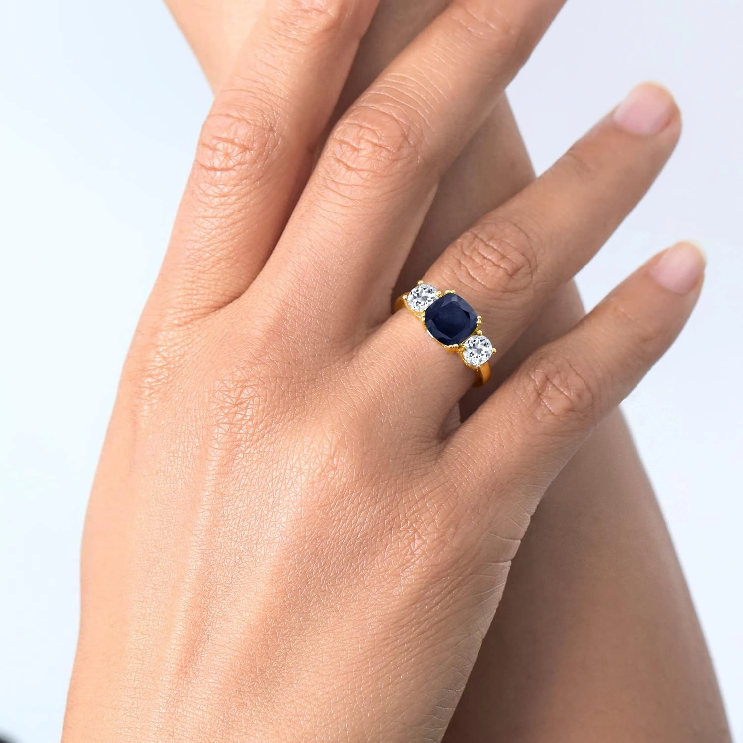 Gem Stone King 18K Yellow Gold Plated Silver Blue Sapphire and White Topaz 3 Stone Engagement Ring For Women (4.02 Cttw, Gemstone September Birthstone, Cushion 8MM, Available in Size 5,6,7,8,9)