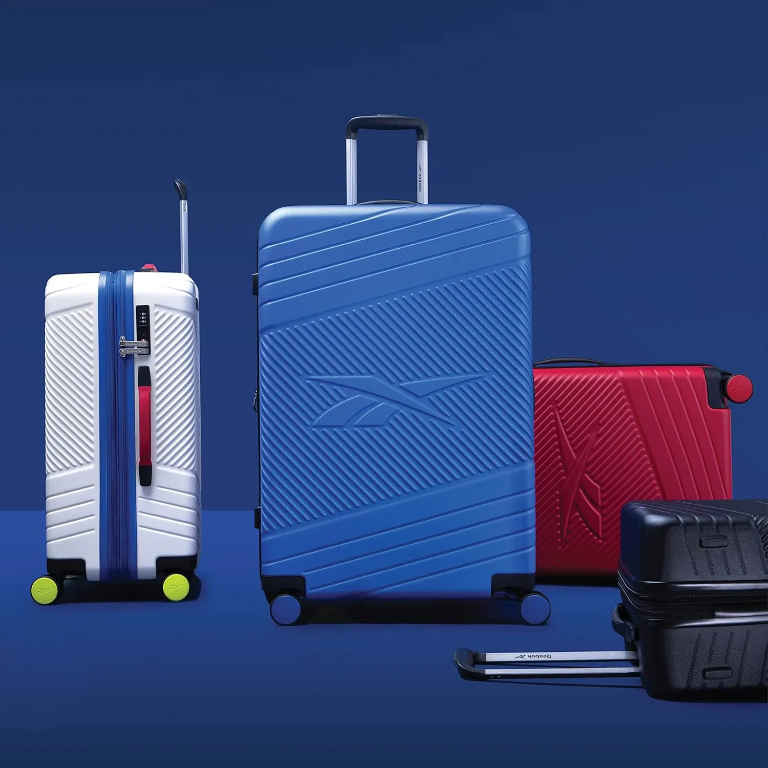 Reebok Go Collection 28 Inch Hard Shell Luggage for Airplanes, Large ABS/PC Hardside Expandable Suitcase with 360-Degree Spinner Wheels, Retractable Handle, Includes Shoe Bag, Red