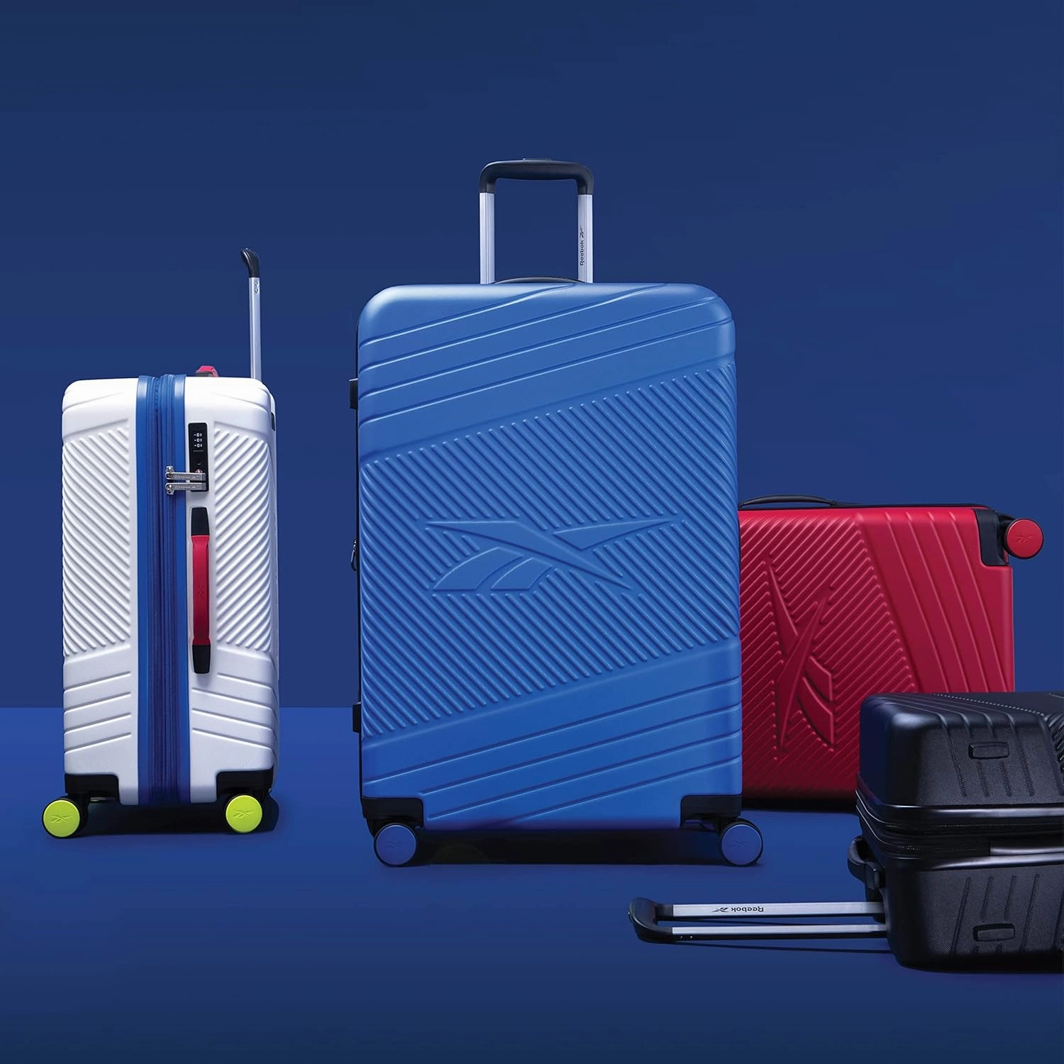 Reebok Go Collection 28 Inch Hard Shell Luggage for Airplanes, Large ABS/PC Hardside Expandable Suitcase with 360-Degree Spinner Wheels, Retractable Handle, Includes Shoe Bag, Black
